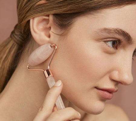 woman-using-face-tool-close-up